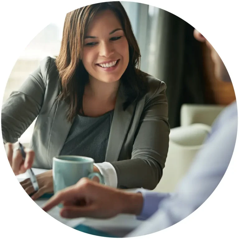 Smiling female staff accountant in a collaborative meeting