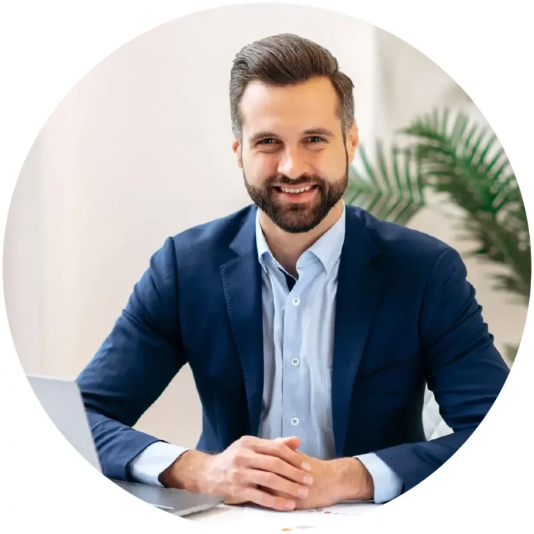 Professionally dressed man smiling at the camera